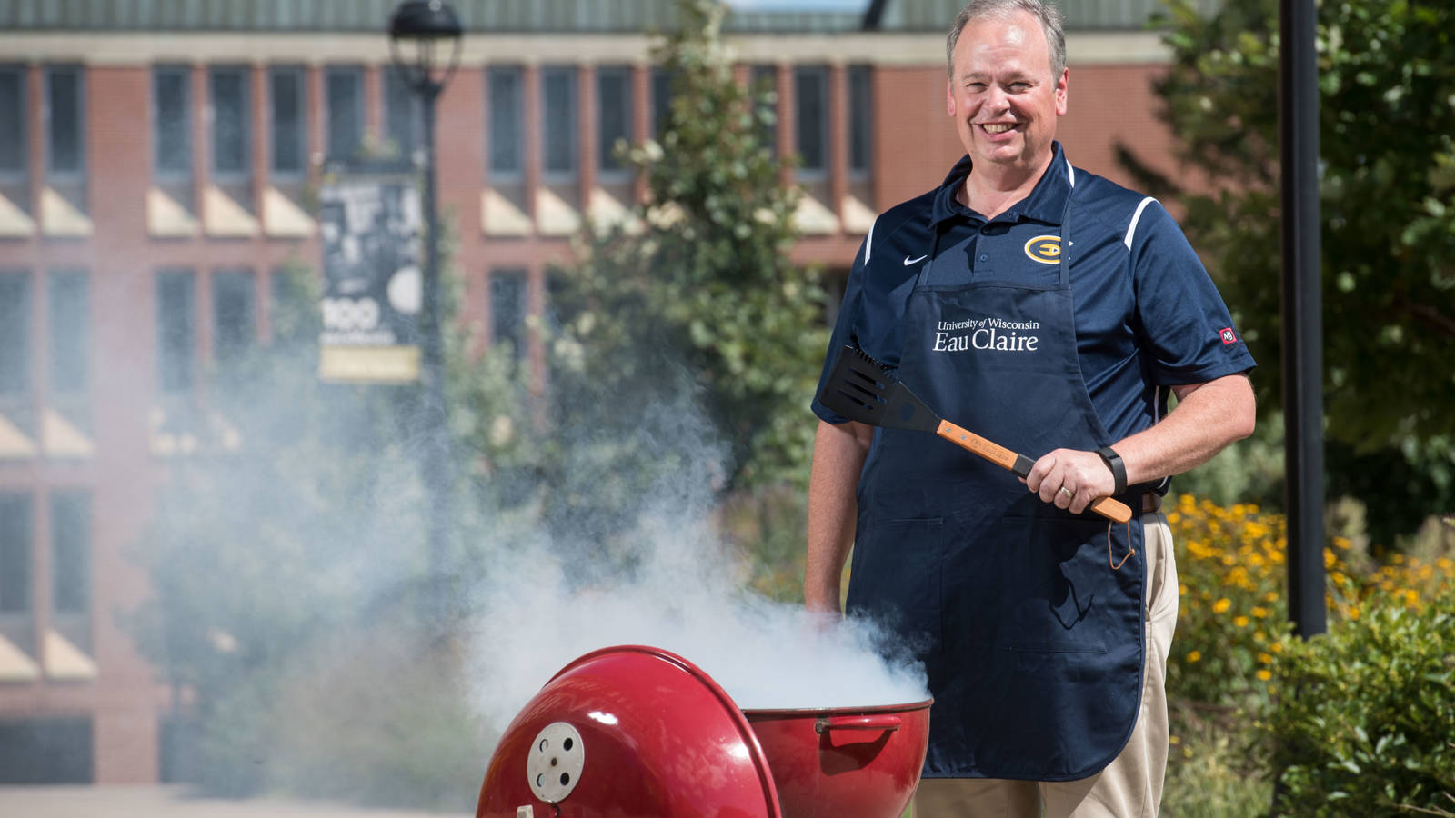 Chancellor Jim Schmidt grilling on campus, August 2018.