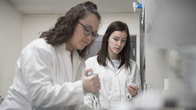 Abbey Kastner (left) and Amelia Schneider are among the first UW-Eau Claire students to declare neuroscience as their major. The Blugolds work in a psychology lab.