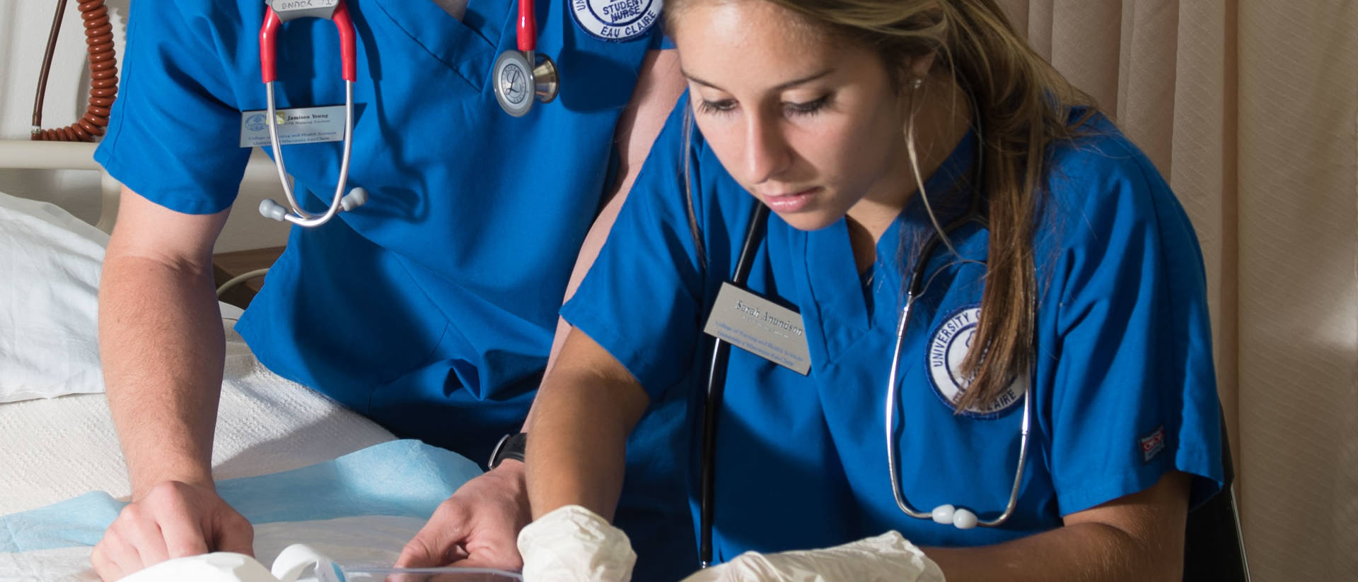 Two UW-Eau Claire nursing students work in the simulation lab. 