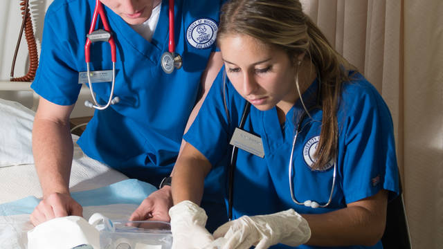 Two UW-Eau Claire nursing students work in the simulation lab. 