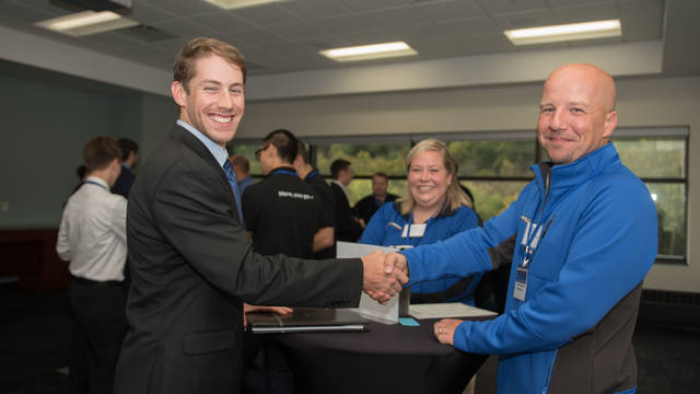 CS student and potential employer at a networking event